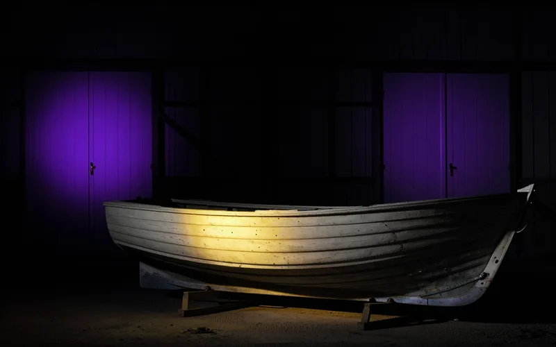 Old boat hull on trestles with one new plank