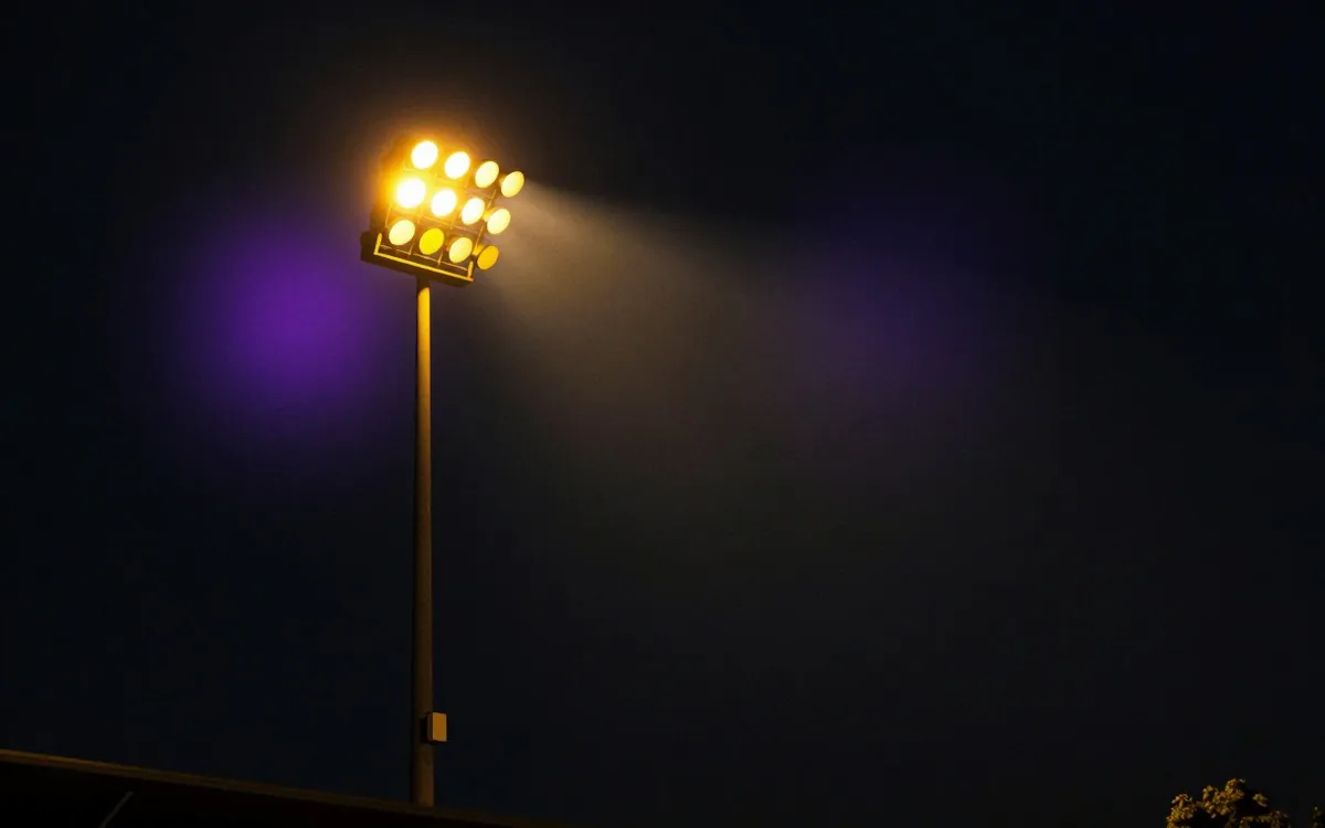 Floodlight mast at night, lamp off
